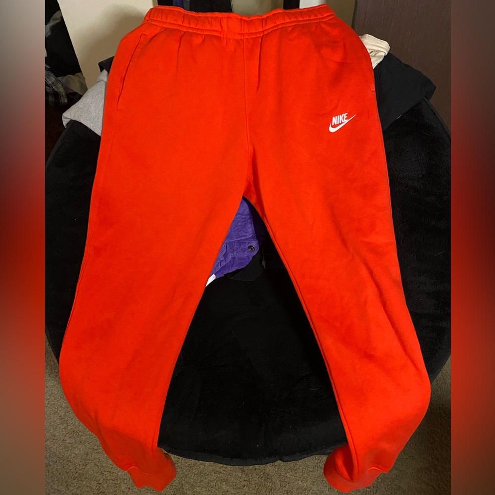 Red orange nike joggers
